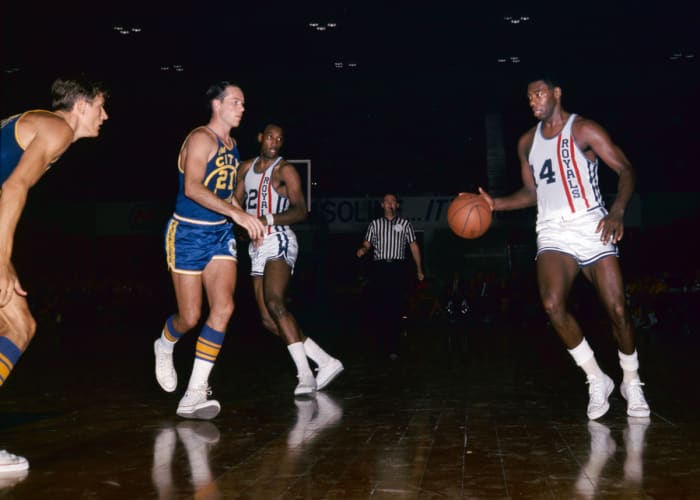 Unknown date; Cincinnati, OH, USA: FILE PHOTO; Cincinnati Royals guard Oscar Robertson (14) is defended by San Francisco Warriors guard Jim King (21) at Cincinnati Gardens.